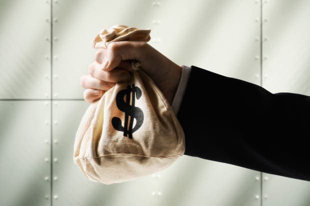 it_salary_watch_13_business_man_holding_dollar_sign_money_bag_thinkstock-100646260-primary-idge